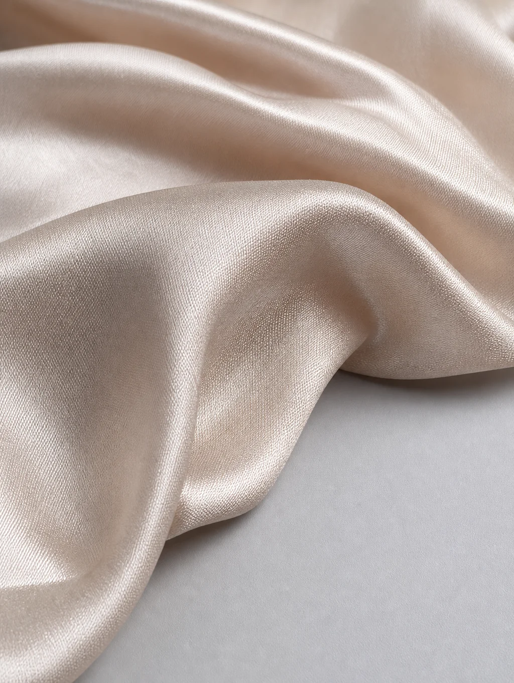 Silk fabric draped in deep shadow and light